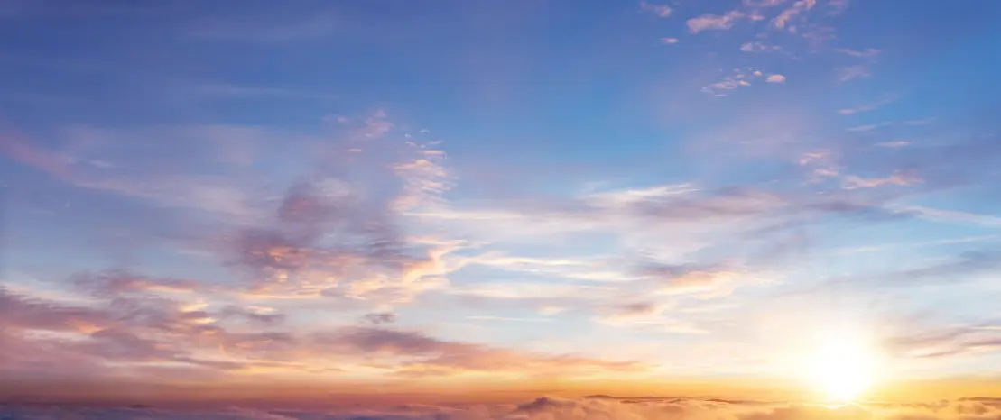 Colorful sunset sky with wispy clouds