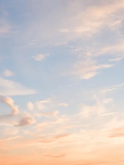 Pastel sunset sky with wispy clouds