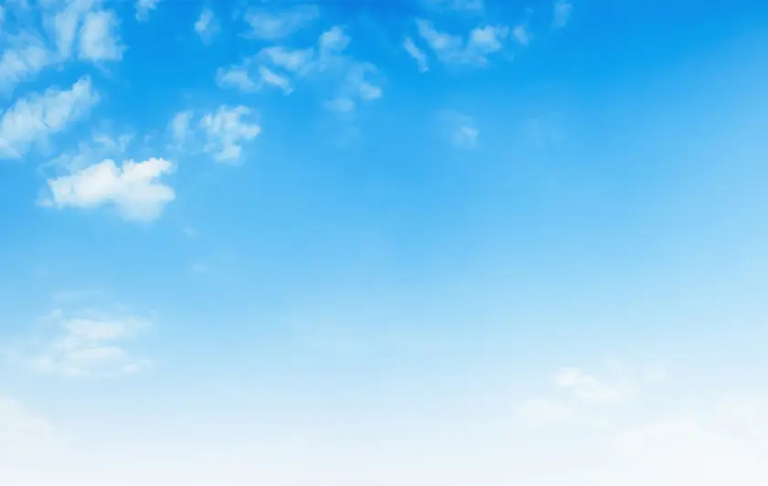 Clear blue sky with wispy clouds