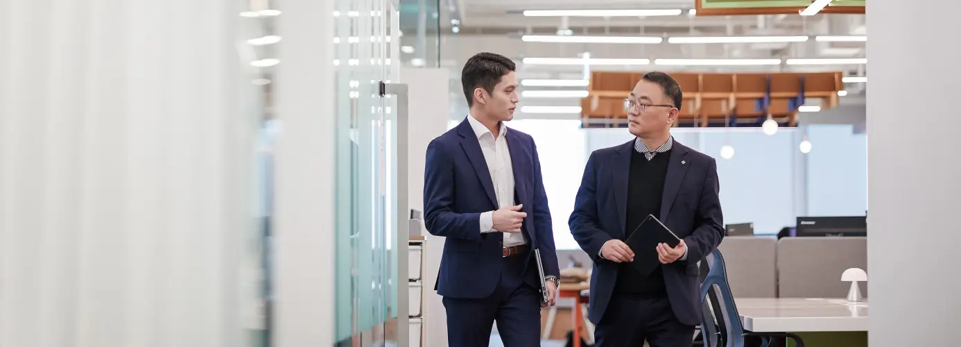 Two collaborators discussing in an office environment