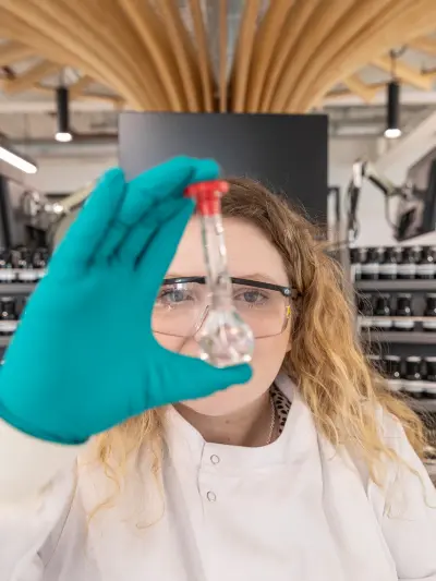 Scientist examining a flask in a laboratory