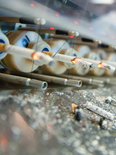 Burning cigarettes in a smoking machine for research