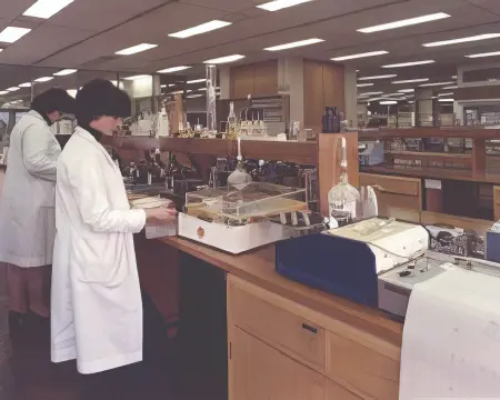 Scientist examining sample in lab