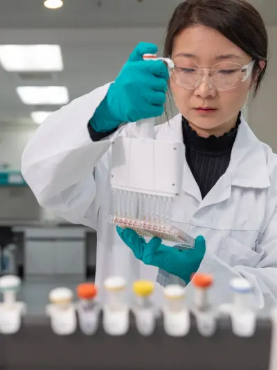 Scientist examining test tubes in laboratory