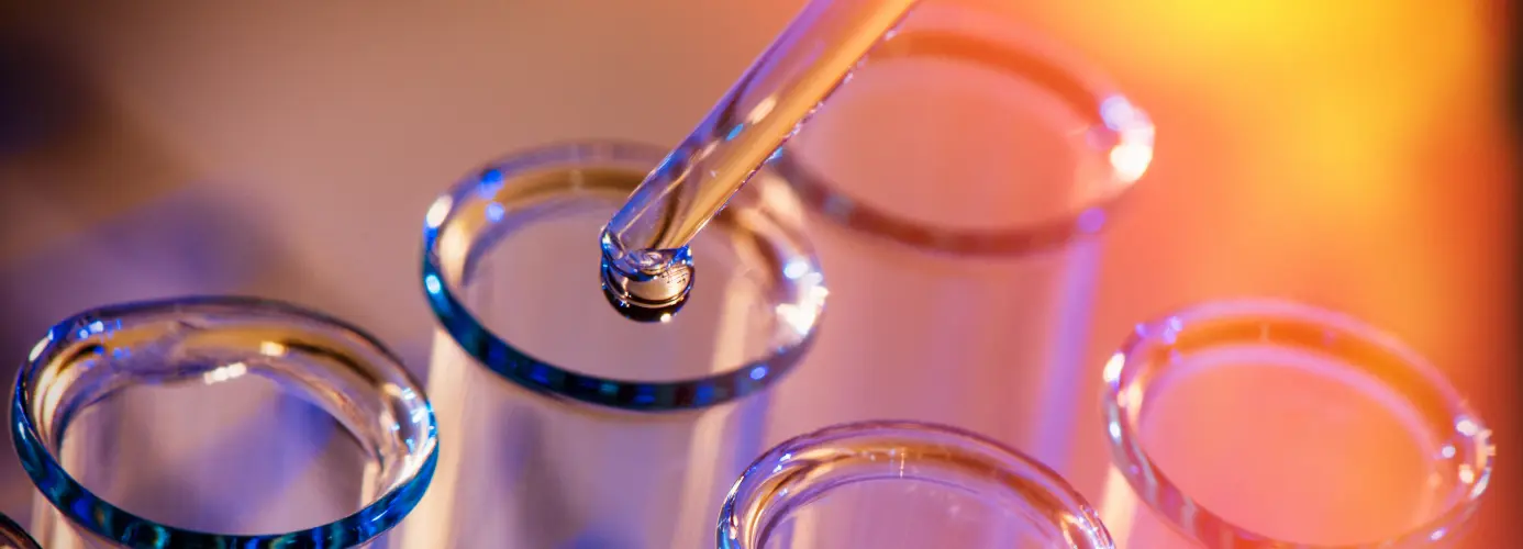 Laboratory test tubes on colourful background